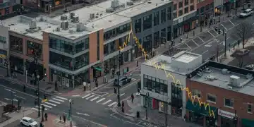 Urban street with reduced pedestrian activity, modern retail stores.